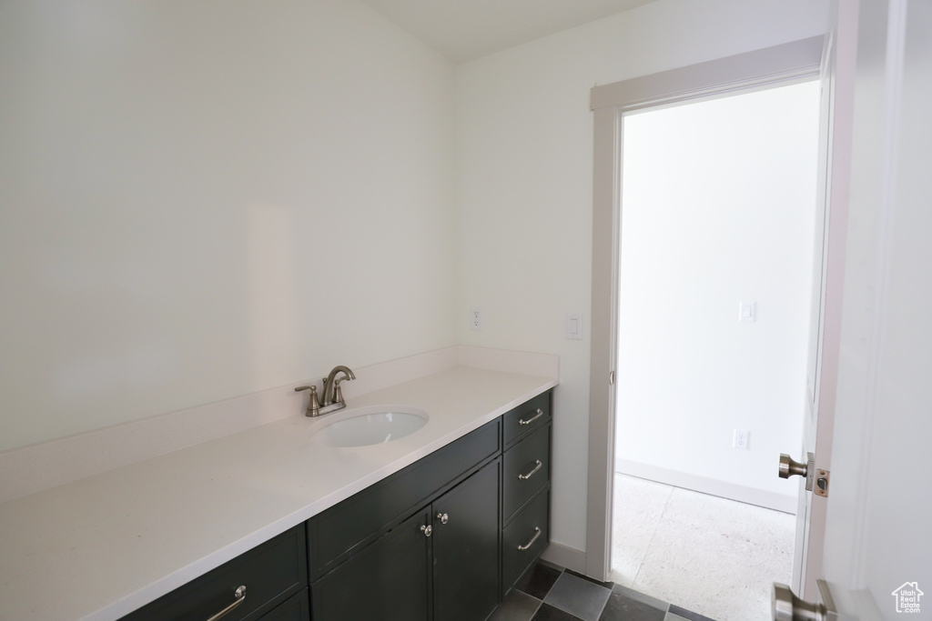 Bathroom with baseboards and vanity