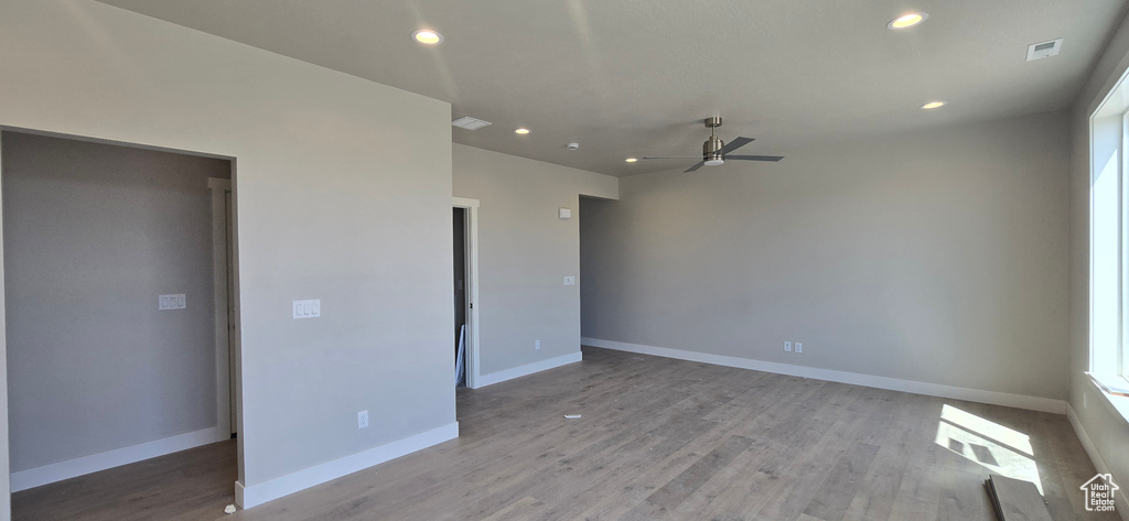 Unfurnished bedroom with visible vents, recessed lighting, ceiling fan, baseboards, and light wood-style floors