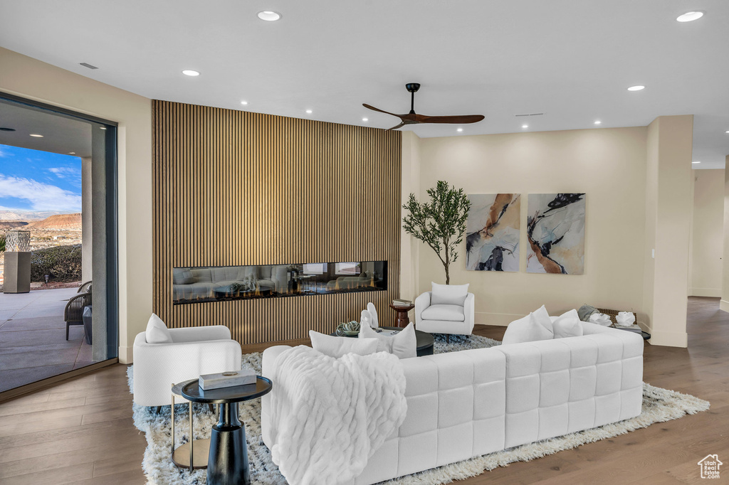 Living room featuring recessed lighting, baseboards, ceiling fan, and wood finished floors