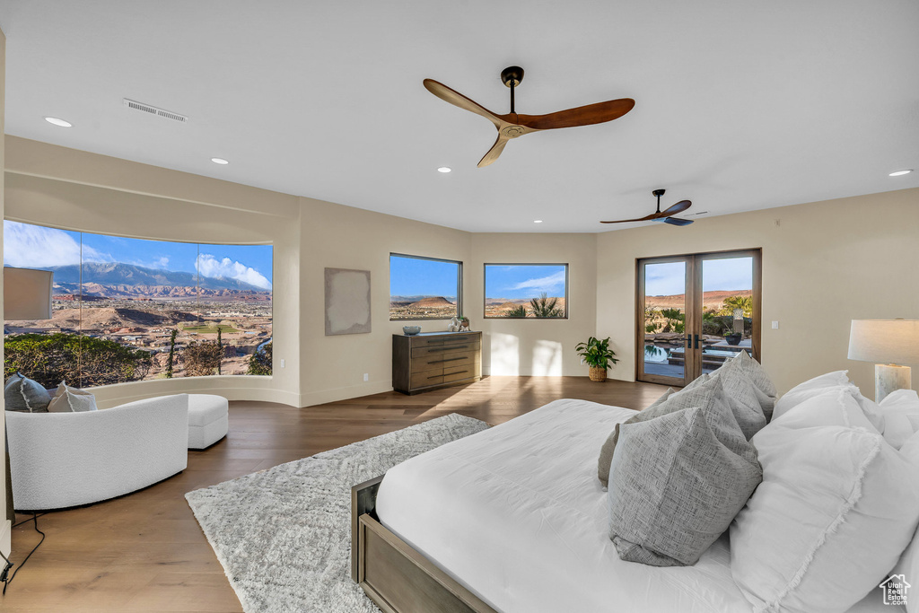 Bedroom featuring visible vents, ceiling fan, recessed lighting, wood finished floors, and access to outside