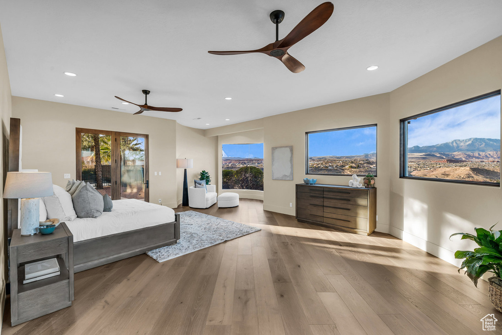 Bedroom featuring recessed lighting, baseboards, wood finished floors, and a ceiling fan
