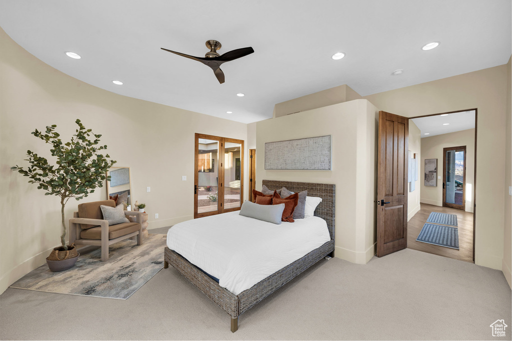 Bedroom with ceiling fan, recessed lighting, baseboards, and light carpet