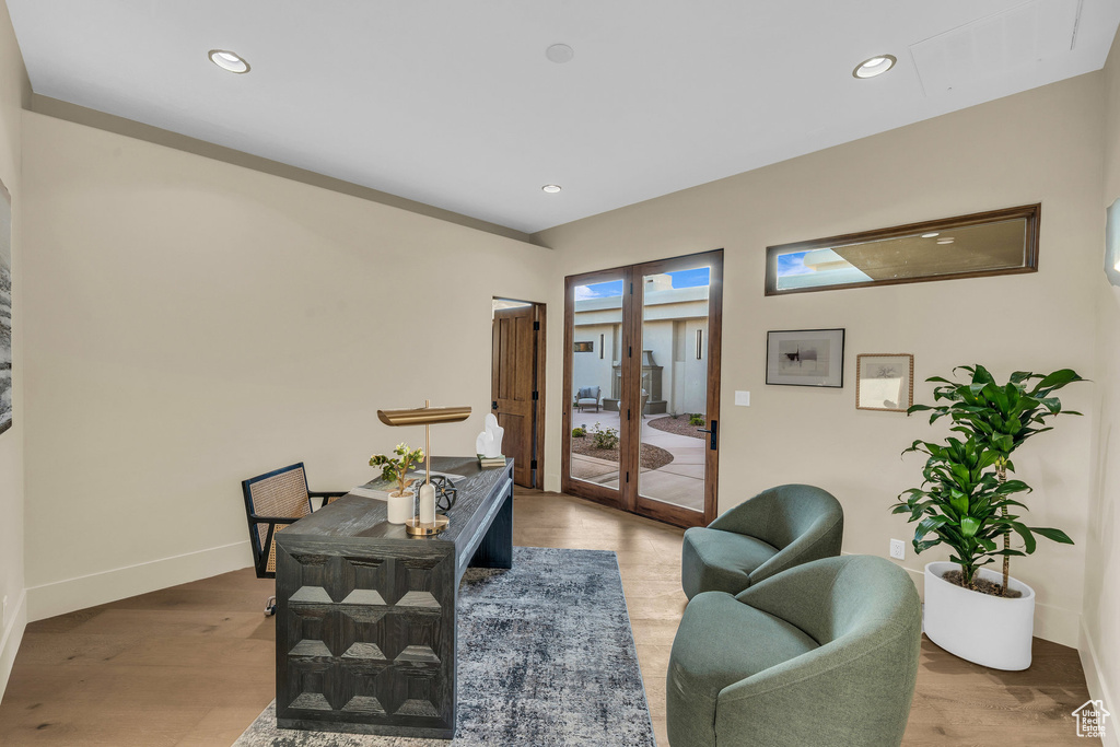 Office area featuring wood finished floors, recessed lighting, and baseboards
