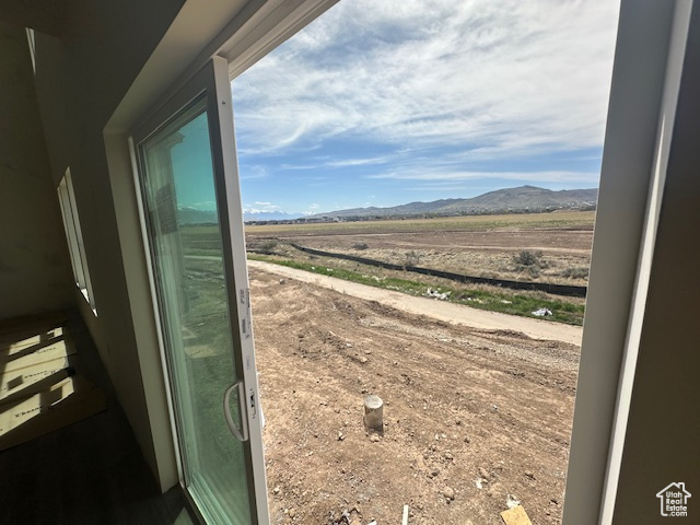 Exterior space with a rural view and a mountain view