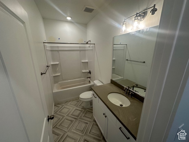 Full bath with visible vents, vanity, tile patterned floors, toilet, and bathing tub / shower combination