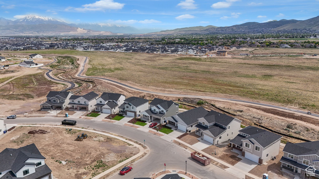 Aerial view of residential area with a mountainous background