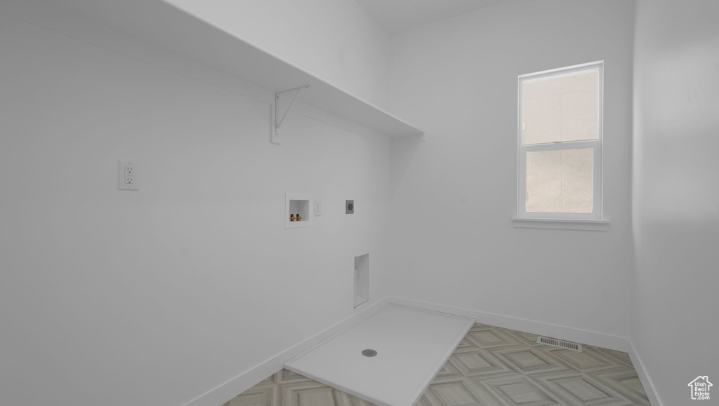 Laundry room with hookup for a washing machine, baseboards, and electric dryer hookup
