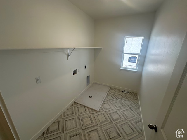 Clothes washing area featuring laundry area, hookup for a washing machine, baseboards, hookup for an electric dryer, and visible vents