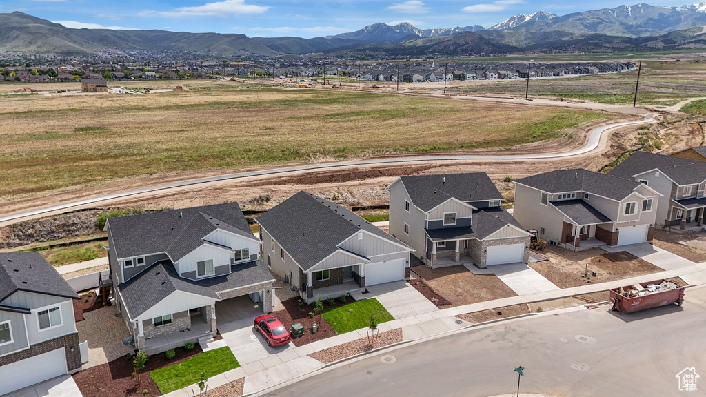 Aerial perspective of suburban area featuring a mountain backdrop