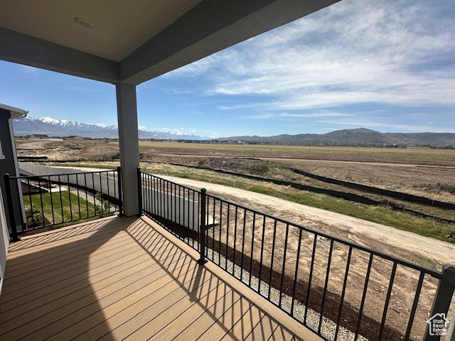Wooden terrace featuring a mountain view