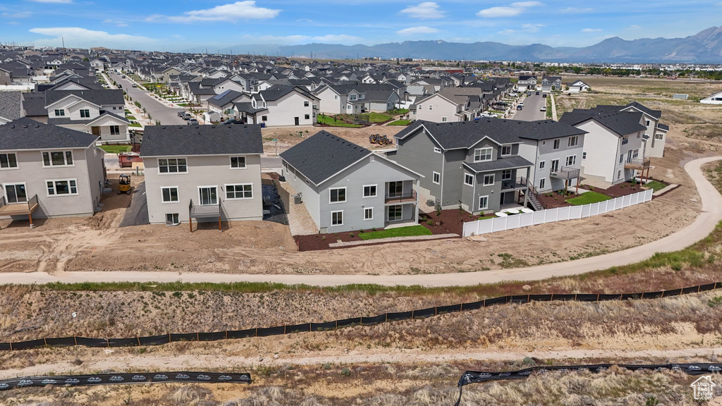 Aerial view of residential area featuring mountains
