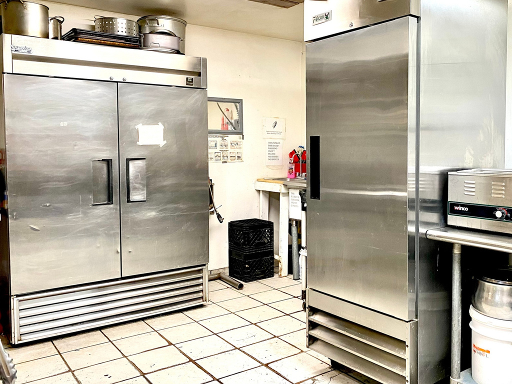 Kitchen featuring high end fridge and built in refrigerator