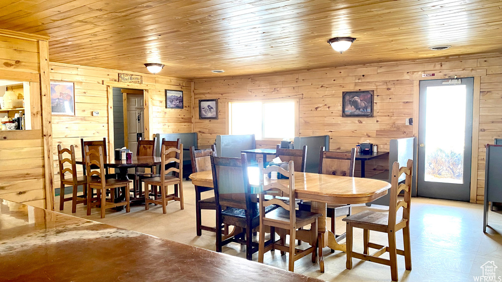 Dining space with wooden walls and wooden ceiling