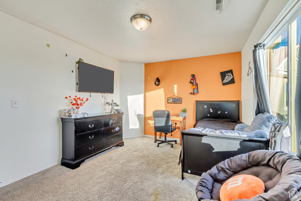Bedroom featuring carpet, visible vents, and baseboards