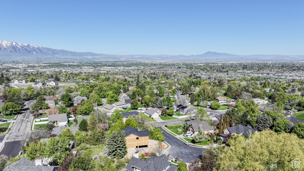 Birds eye view of property featuring a mountain view and a residential view