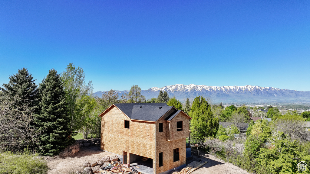 Back of property featuring a mountain view