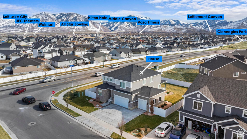 Drone / aerial view featuring a mountain view and a residential view