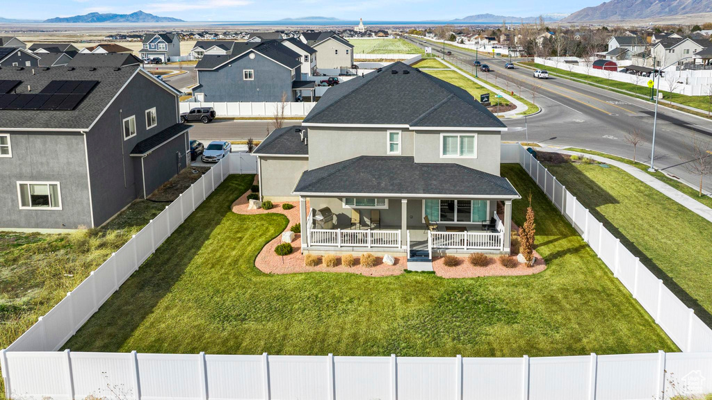 Birds eye view of property with a mountain view and a residential view