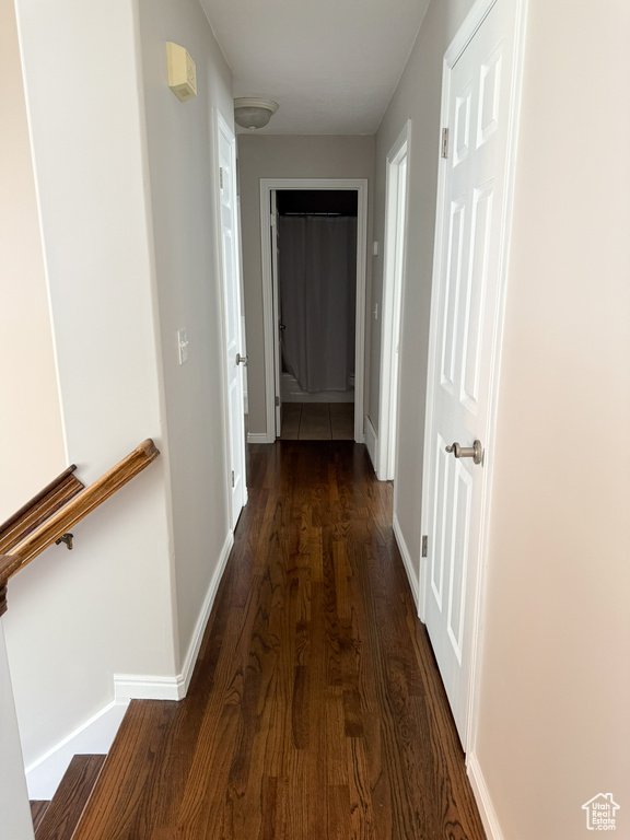 Hall with wood finished floors and baseboards