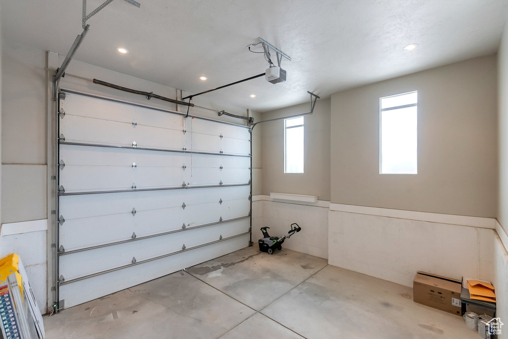 Garage featuring a garage door opener