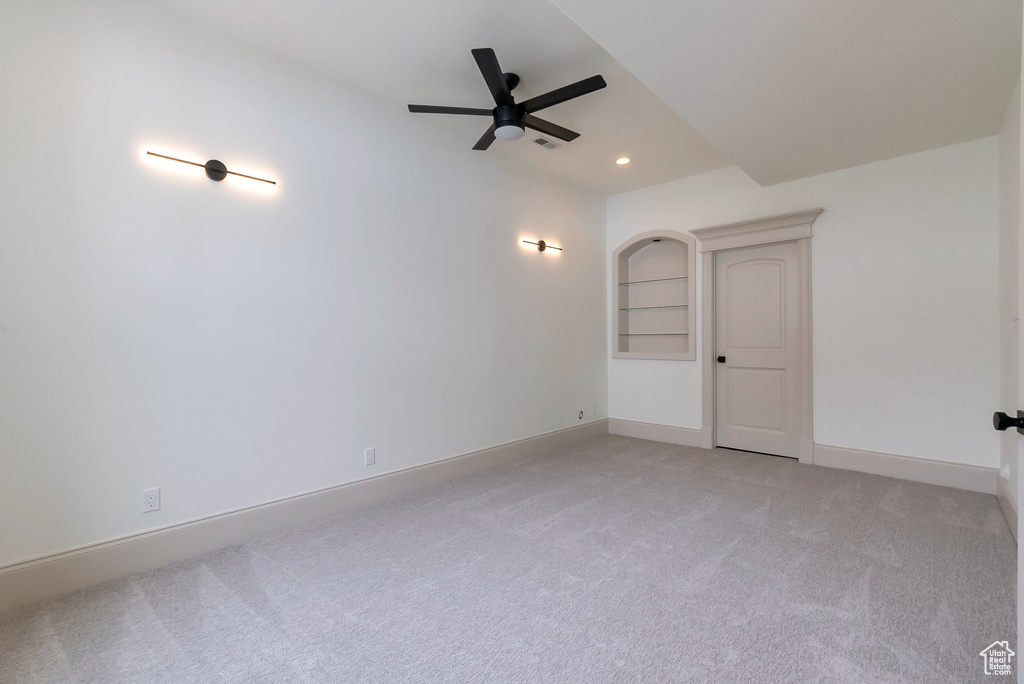 Spare room featuring visible vents, baseboards, recessed lighting, ceiling fan, and light colored carpet