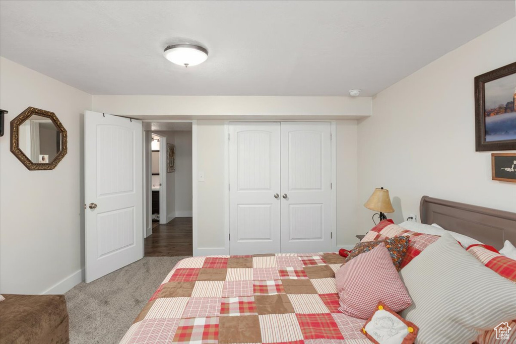 Unfurnished bedroom with carpet flooring, baseboards, and a closet