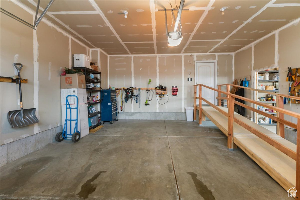Garage featuring a garage door opener