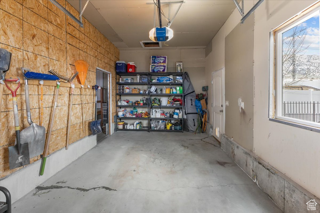 Garage featuring a garage door opener