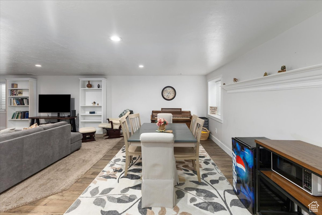 Dining room with recessed lighting, baseboards, and wood finished floors