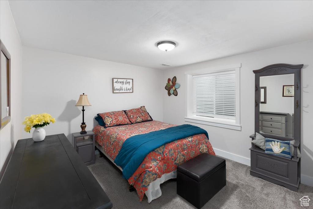 Carpeted bedroom with baseboards