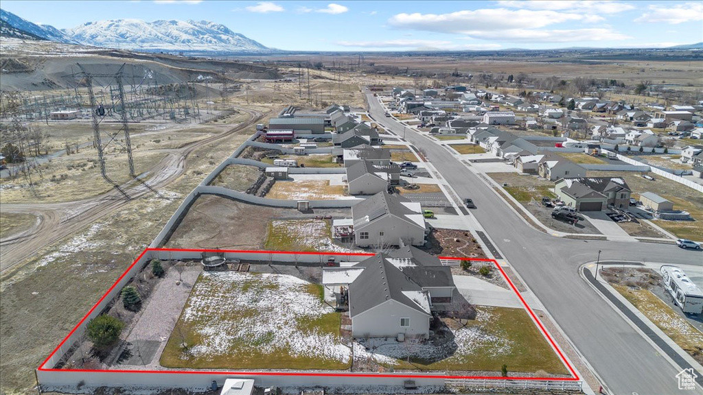 Drone / aerial view featuring a mountain view and a residential view