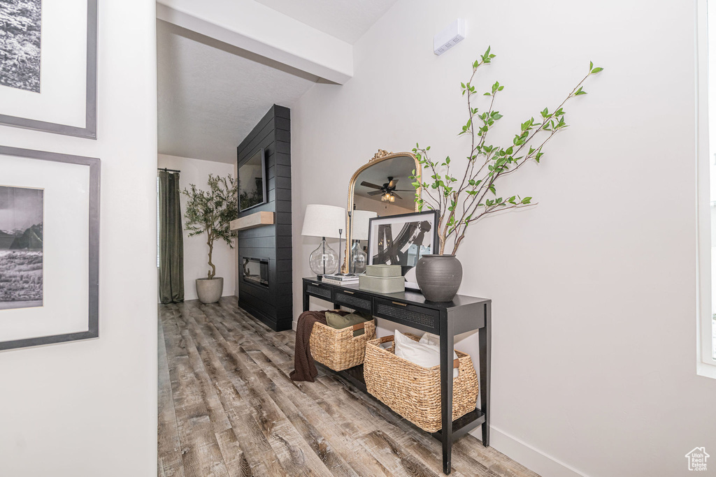 Hallway with wood finished floors and baseboards