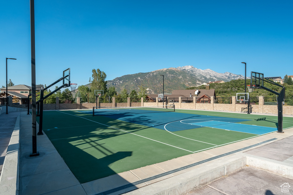 View of basketball court featuring a mountain view and community basketball court