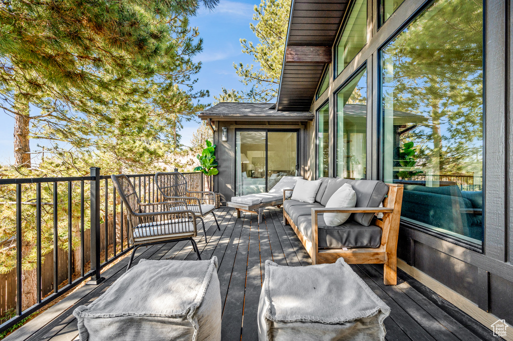 Wooden terrace with an outdoor living space