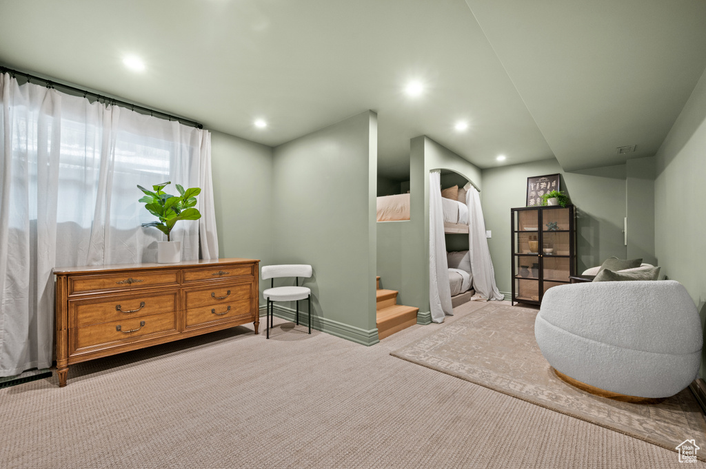 Carpeted bedroom with recessed lighting and baseboards