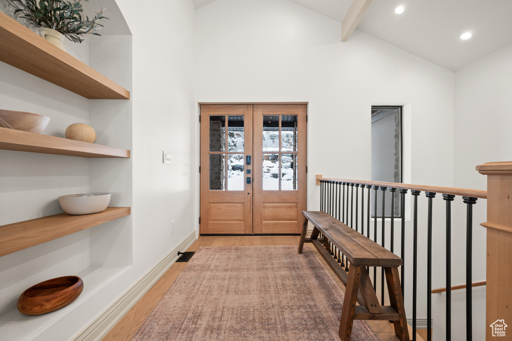 Entryway featuring recessed lighting, vaulted ceiling with beams, light wood-type flooring, and baseboards