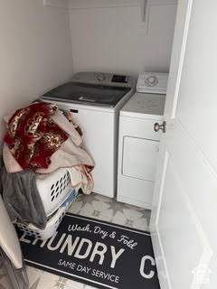 Laundry area featuring laundry area and independent washer and dryer