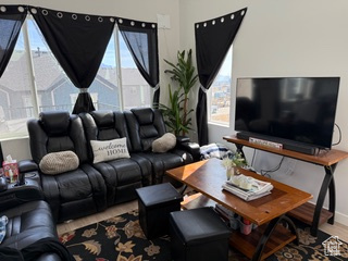 Living room featuring baseboards and wood finished floors