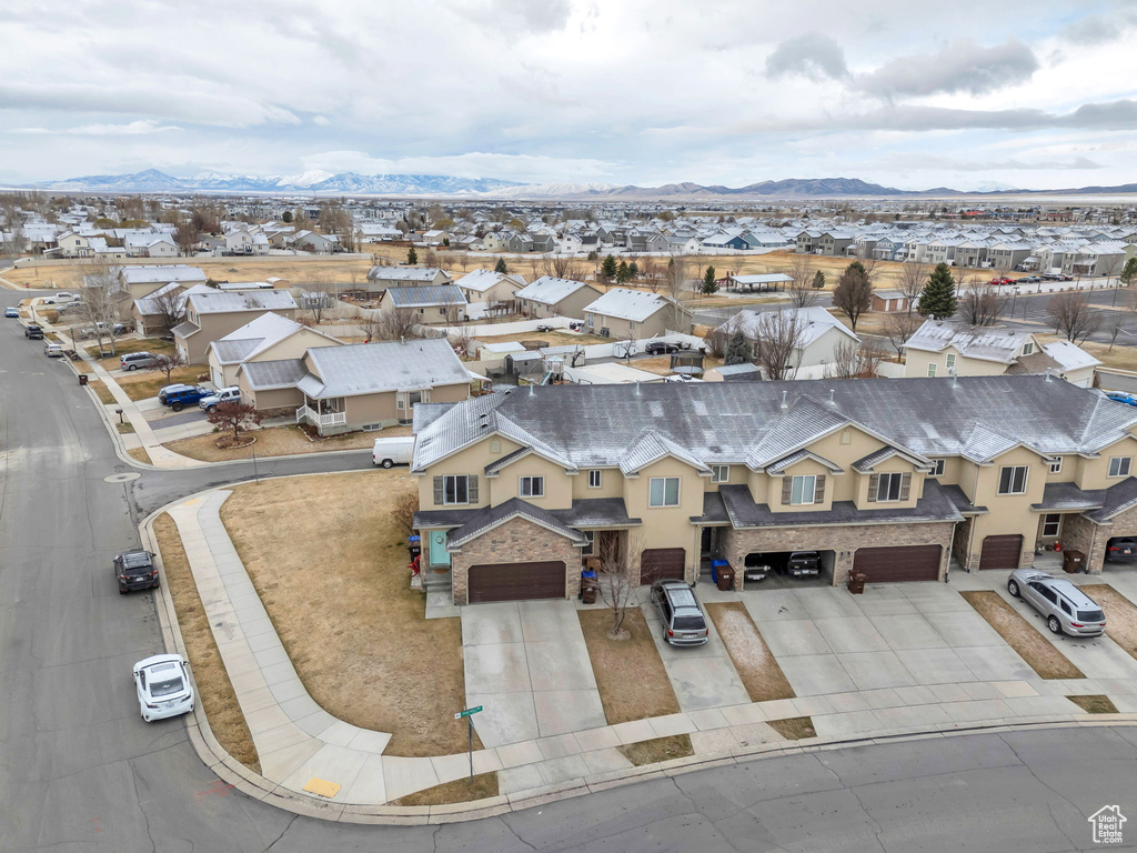 Birds eye view of property with a mountain view and a residential view