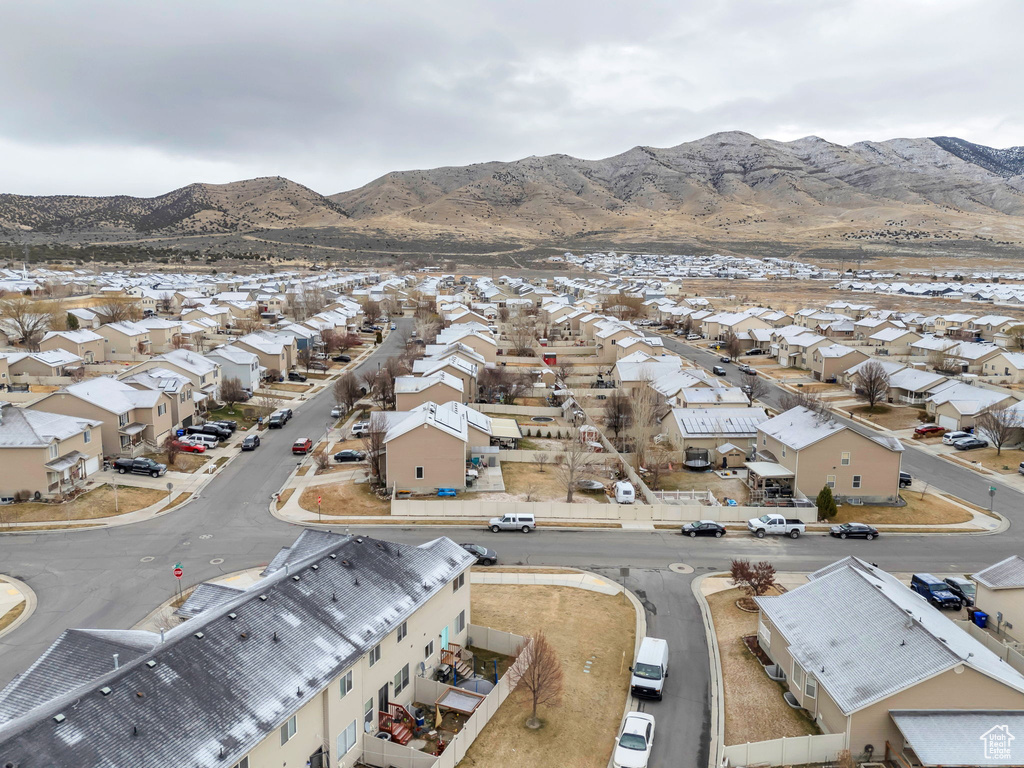 Birds eye view of property with a mountain view and a residential view