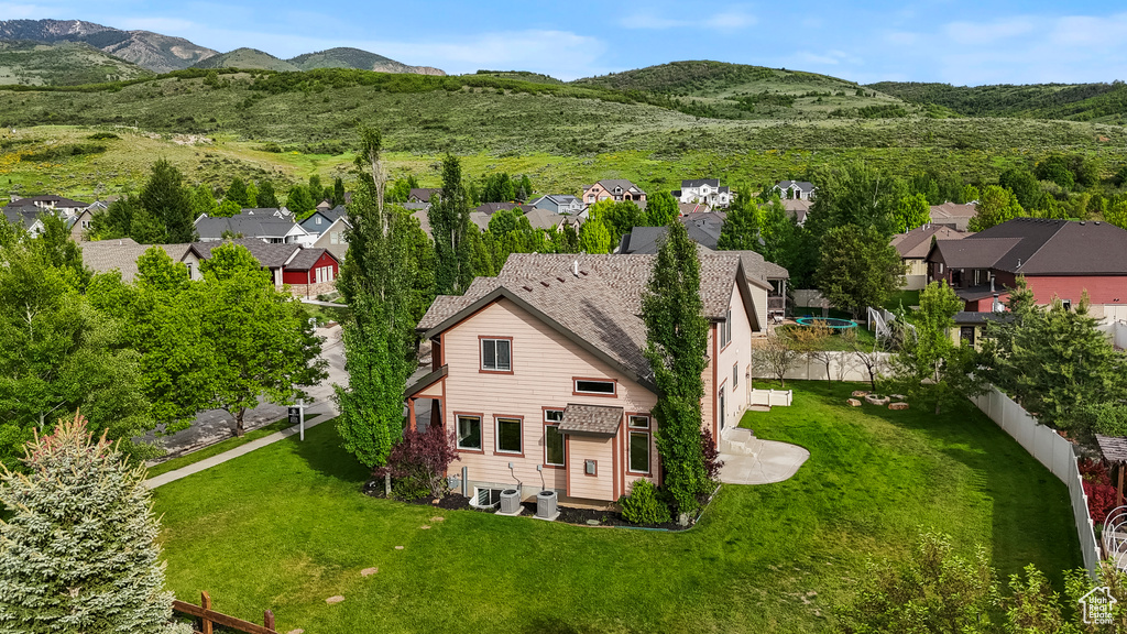 Aerial view of residential area with a mountainous background