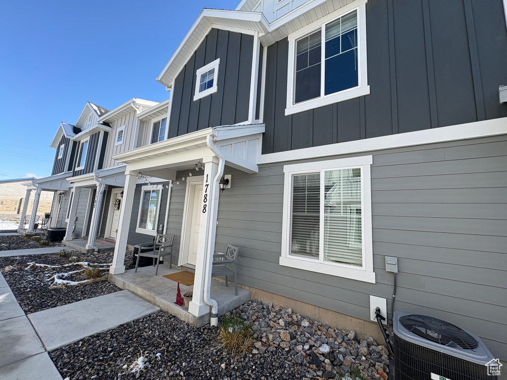 View of side of property featuring cooling unit and board and batten siding