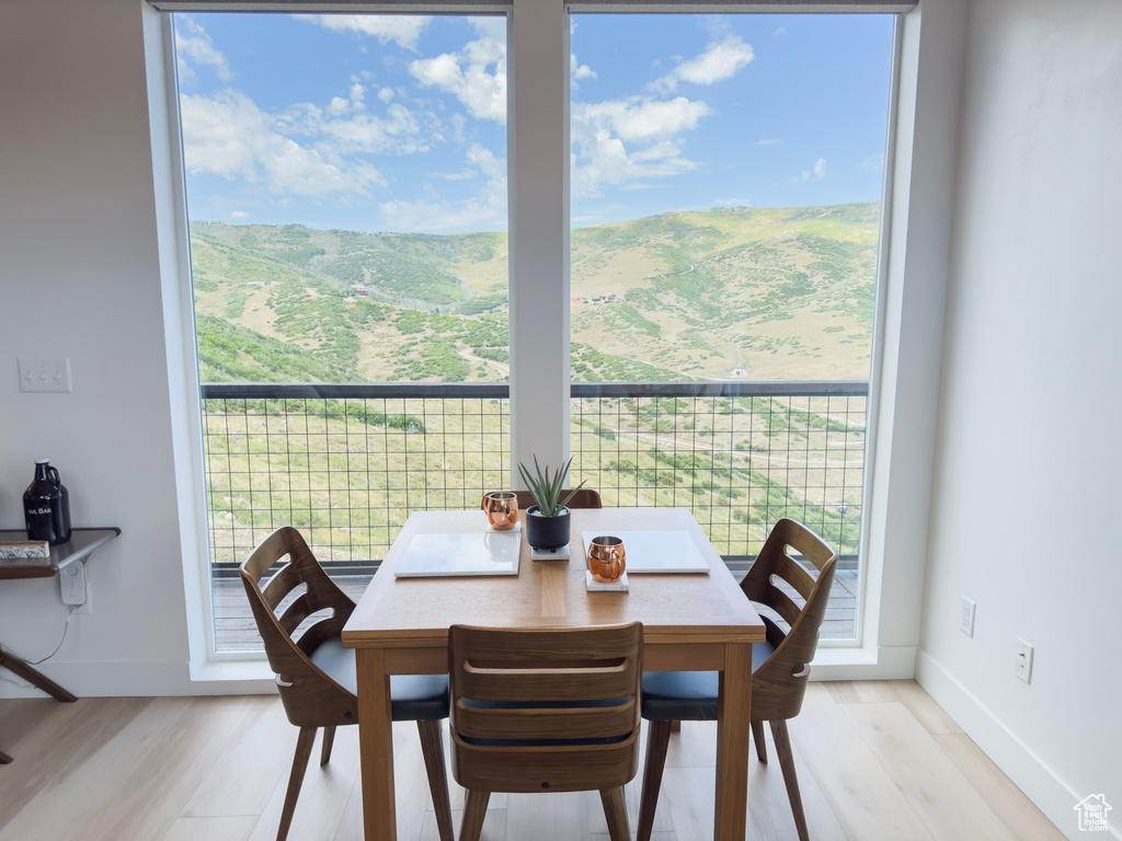 Dining room featuring light wood-style floors and a healthy amount of sunlight