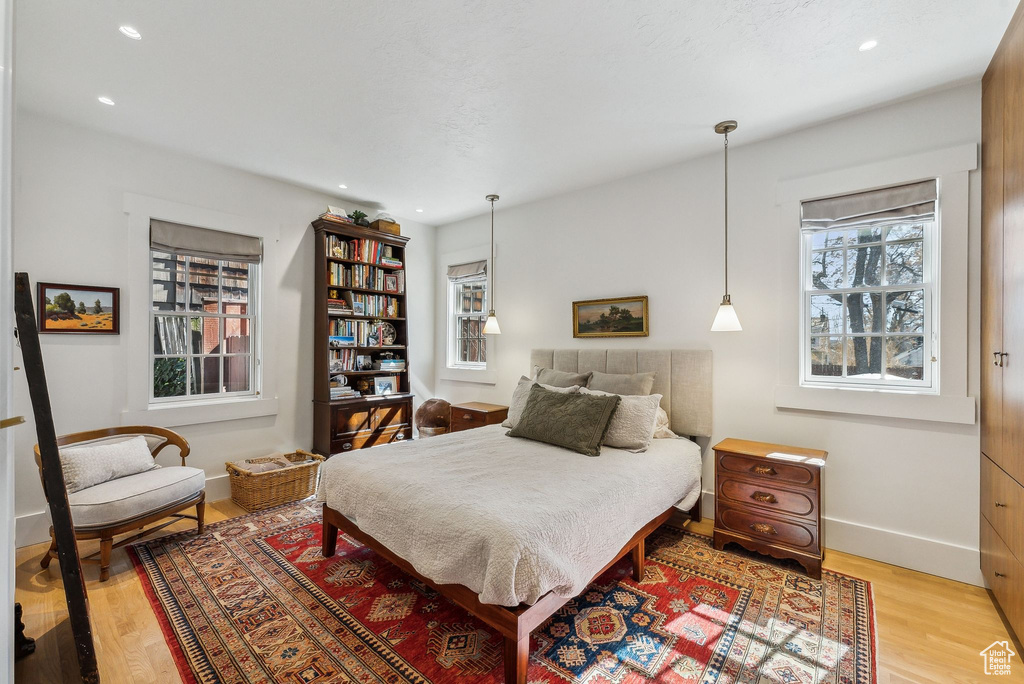Bedroom featuring recessed lighting, wood finished floors, and baseboards