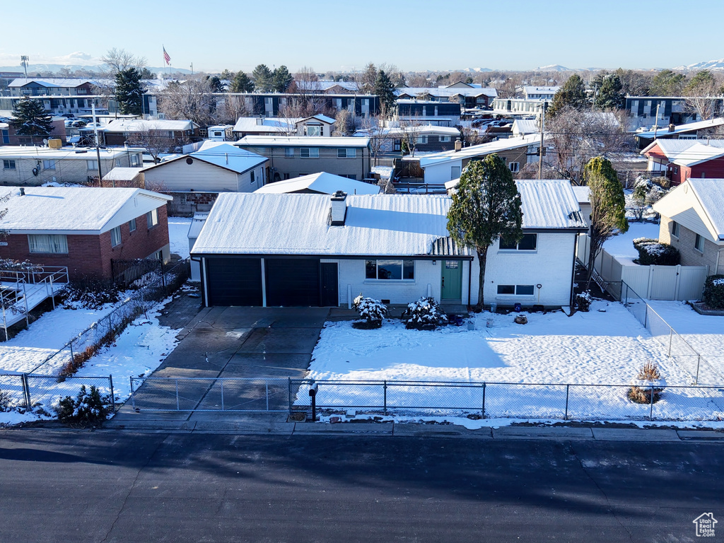 Snowy aerial view with a residential view