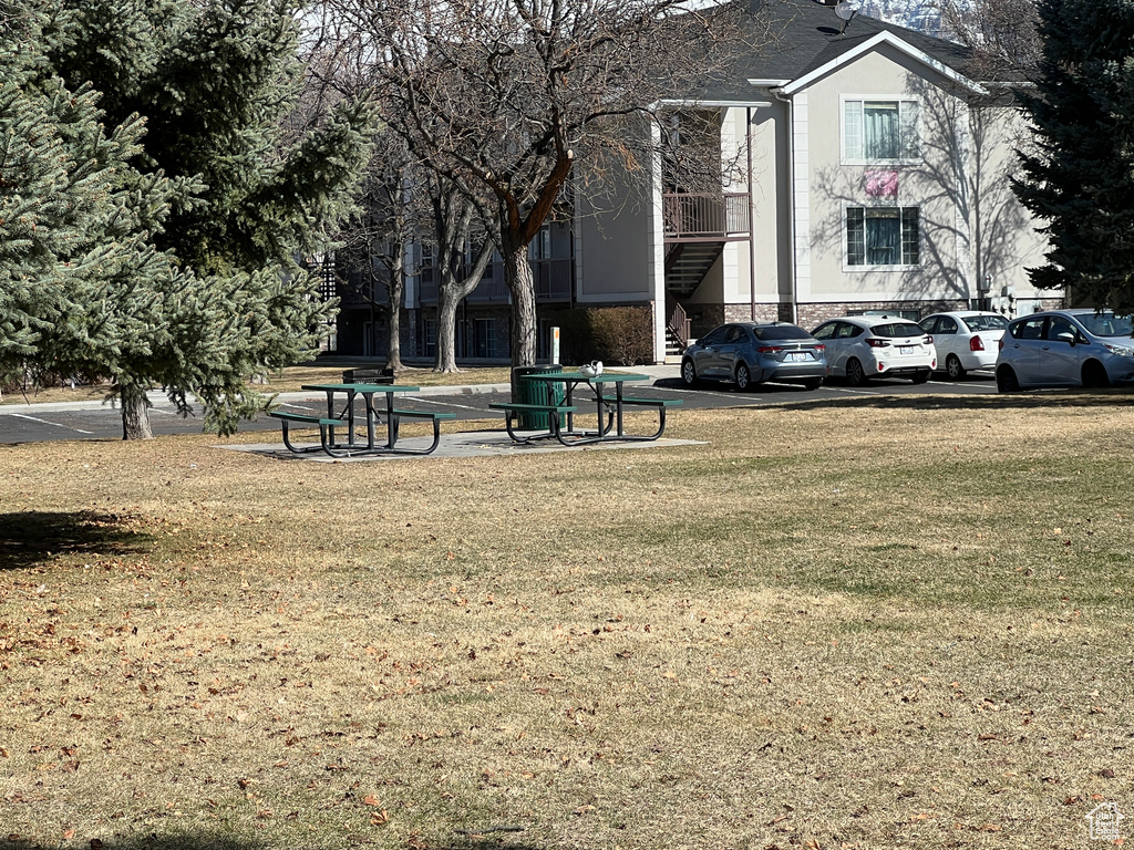 View of community featuring a lawn