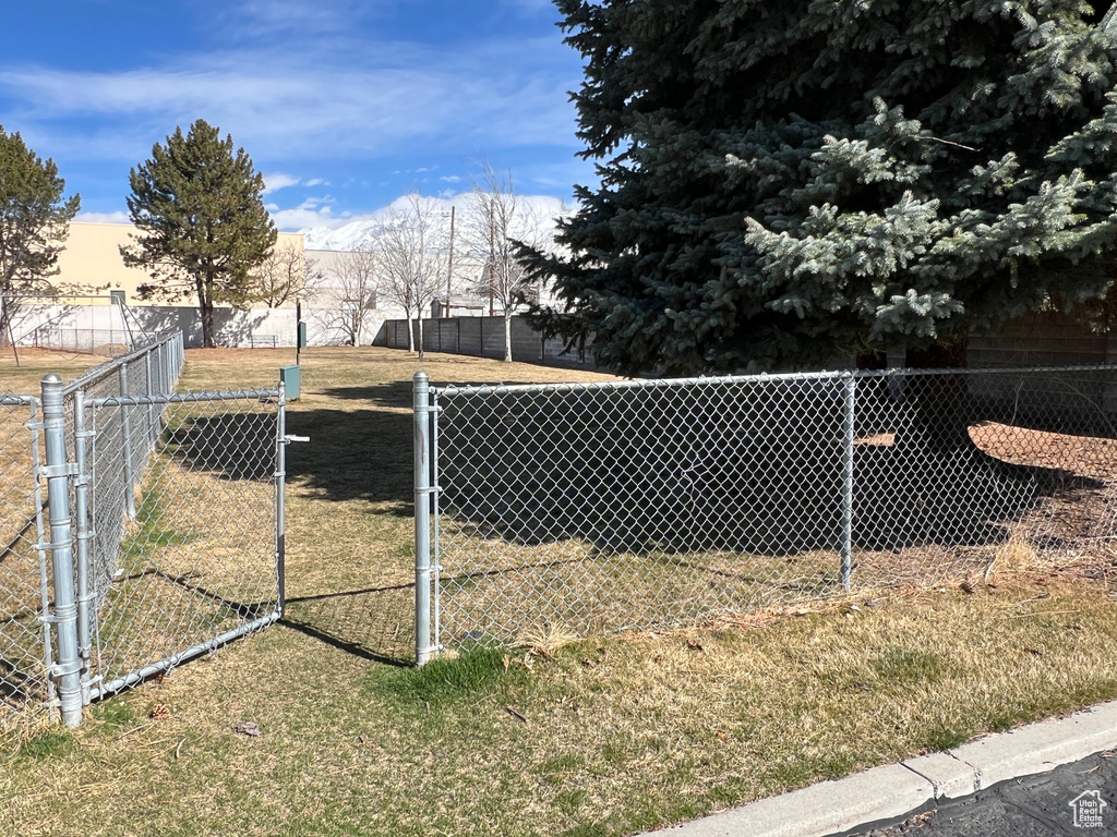 View of yard featuring fence