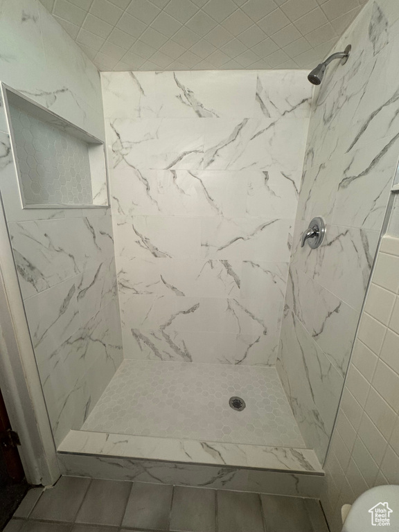 Full bath with a shower stall