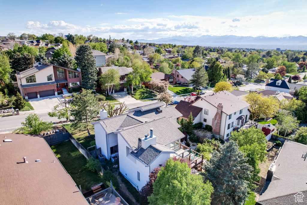 Birds eye view of property featuring a mountain view and a residential view