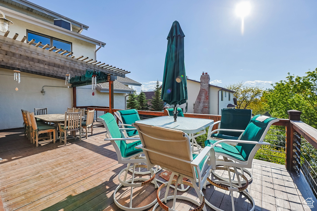 Wooden terrace with outdoor dining space